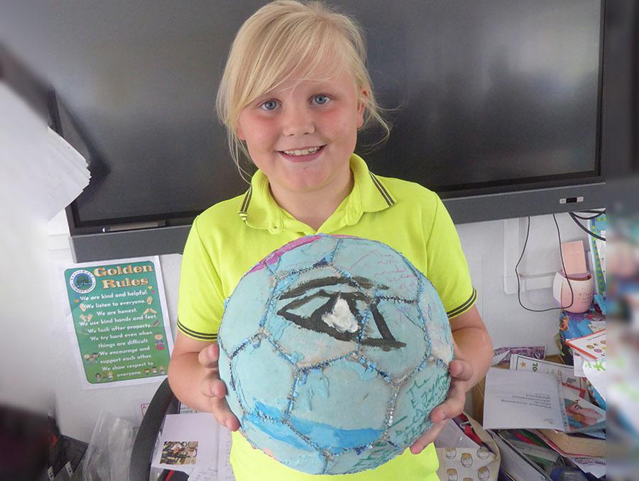 Brilliant home learning! A football painted and decorated with symbols from Ancient Egypt.
