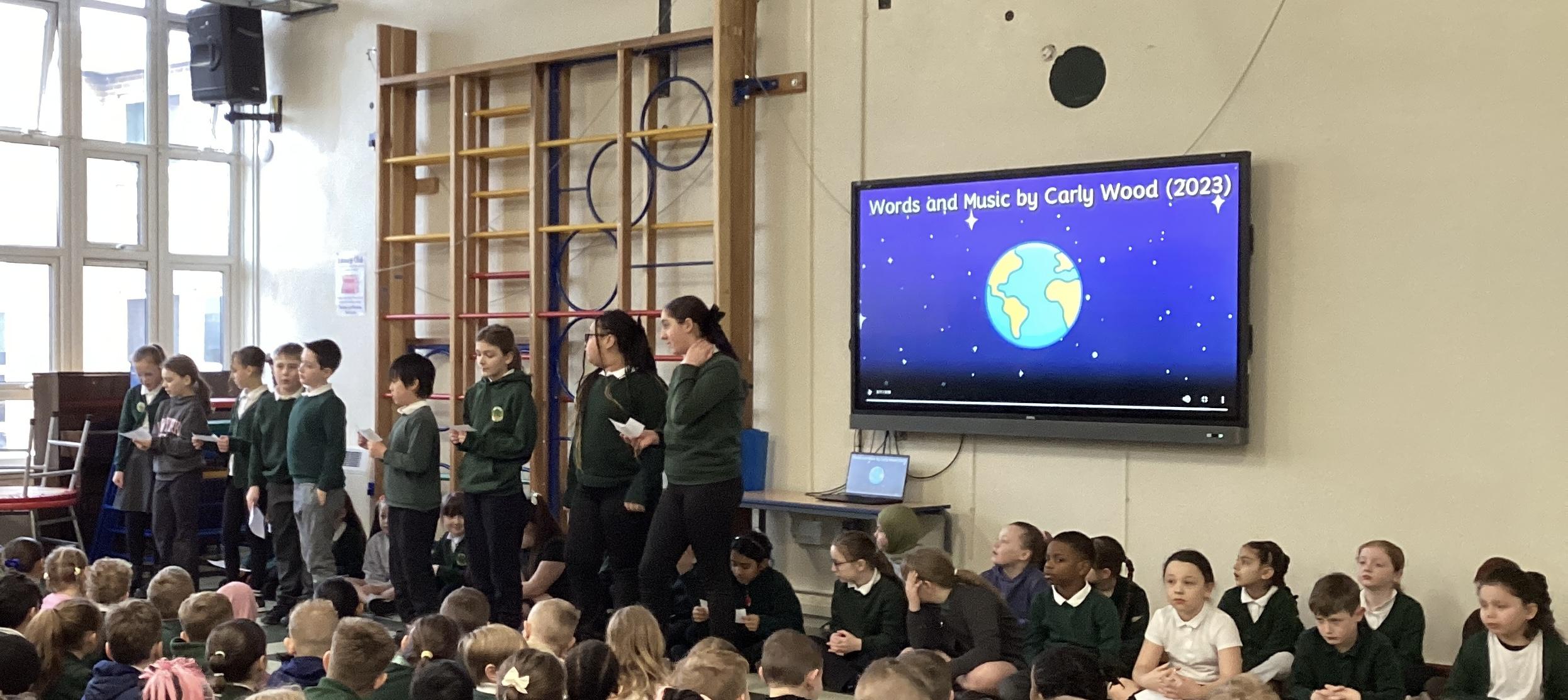 Year 5 explain about our carbon footprint in assembly